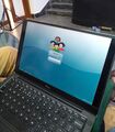 Laptop showing the login screen of IT@School GNU/Linux 3.8.1 (based on Debian Lenny)